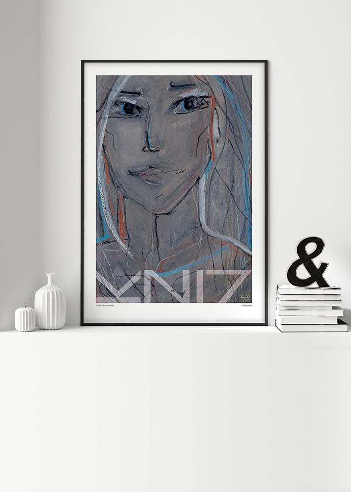 Picture of a framed art print in white living room surroundings