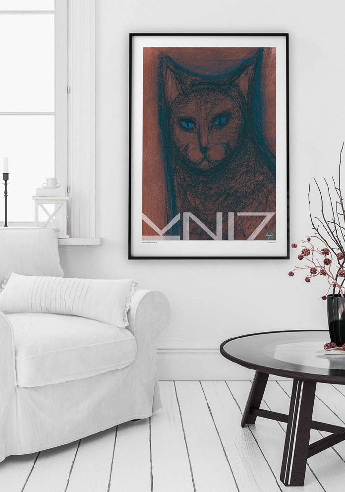 Picture of a white livingroom with armchair in front of window and a large framed art print on the wall
