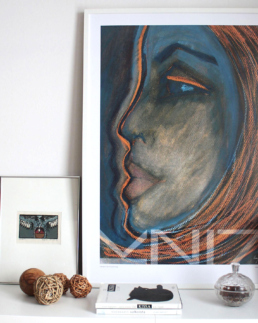 Art poster of a redheaded woman's profile